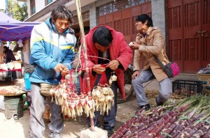 Straw Ornaments and Sugar Cane.Shaxi Friday Market