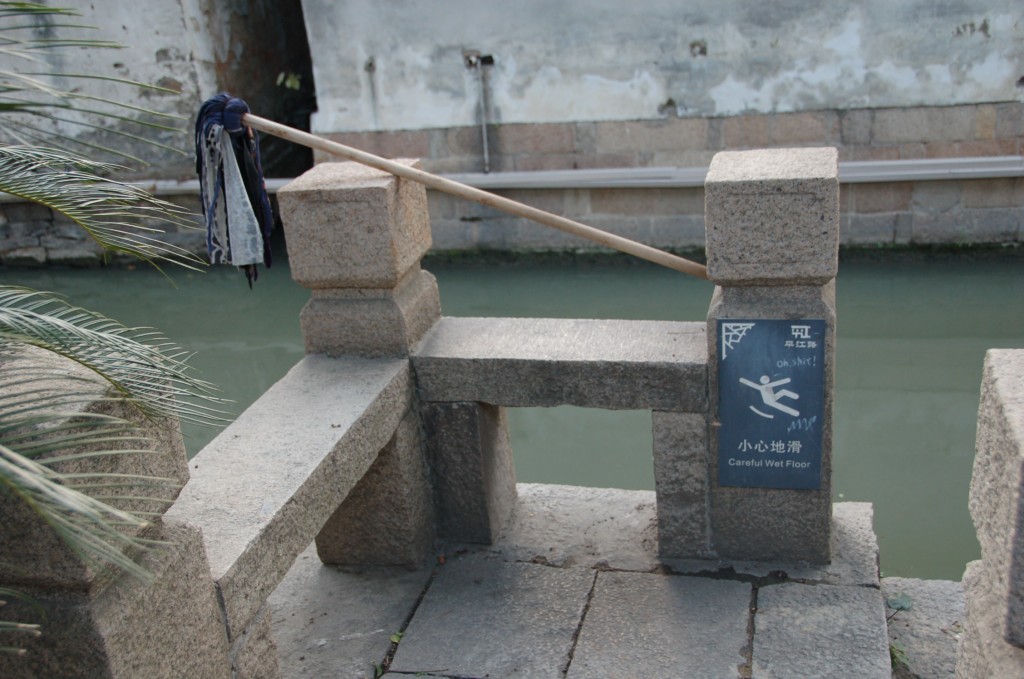 Slip-and-fall mitigation at its best. You'll want to zoom in on the sign, probably. English language signs in China