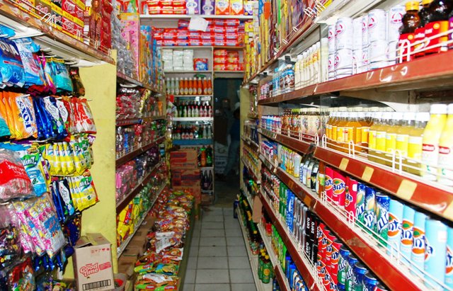 Typical dry goods and sundries shop lining the pasar parking lot