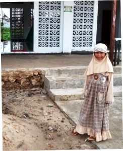 Ramadan in Baikpapan: Little girl with new outfit for holidays.