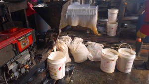 Soy beans being ground into paste for tofu.Balikpapan Tofu Factory.